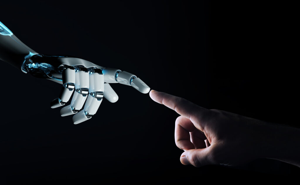 ロボットと人間の指が触れている