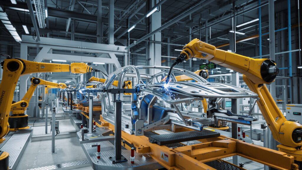 自動車工場で組み立てを行っているロボット