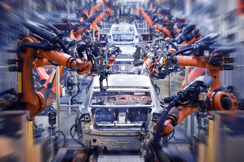 自動車生産ラインに並ぶ産業用ロボット